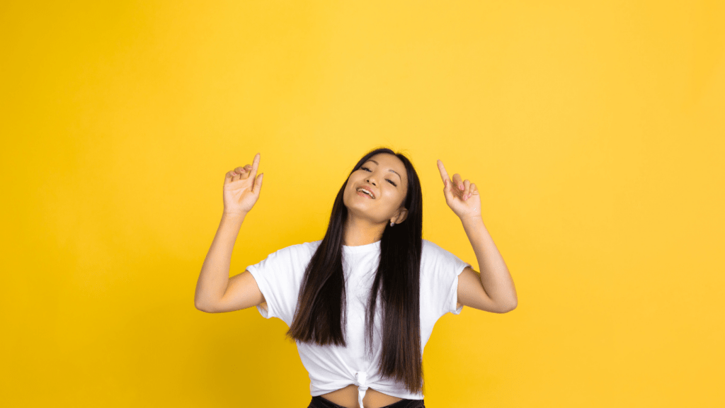 woman pointing upwards