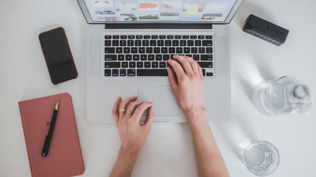 a person holding a laptop