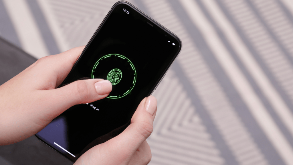 a person holding an iphone with a green circle on the screen