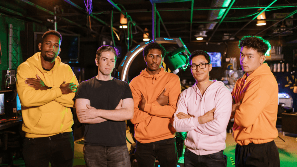 a group of people standing in a dark room