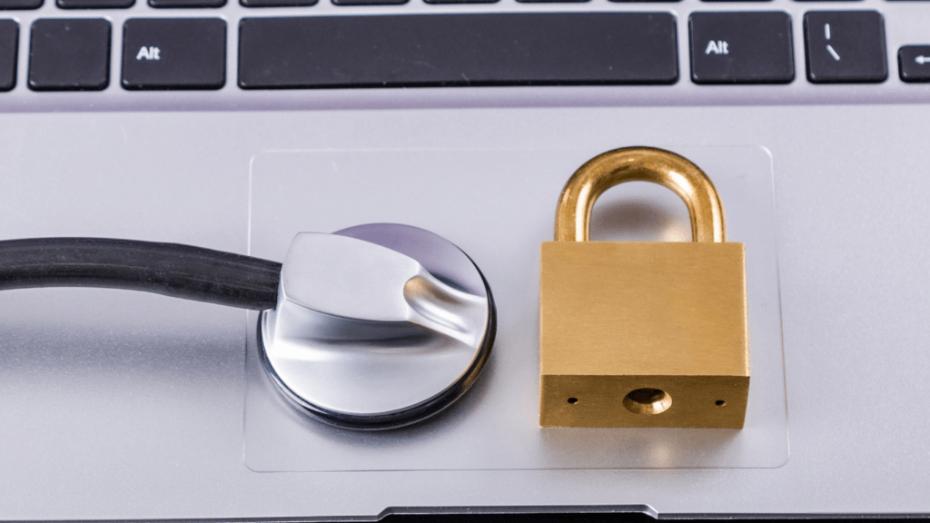 a padlock sitting on a laptop