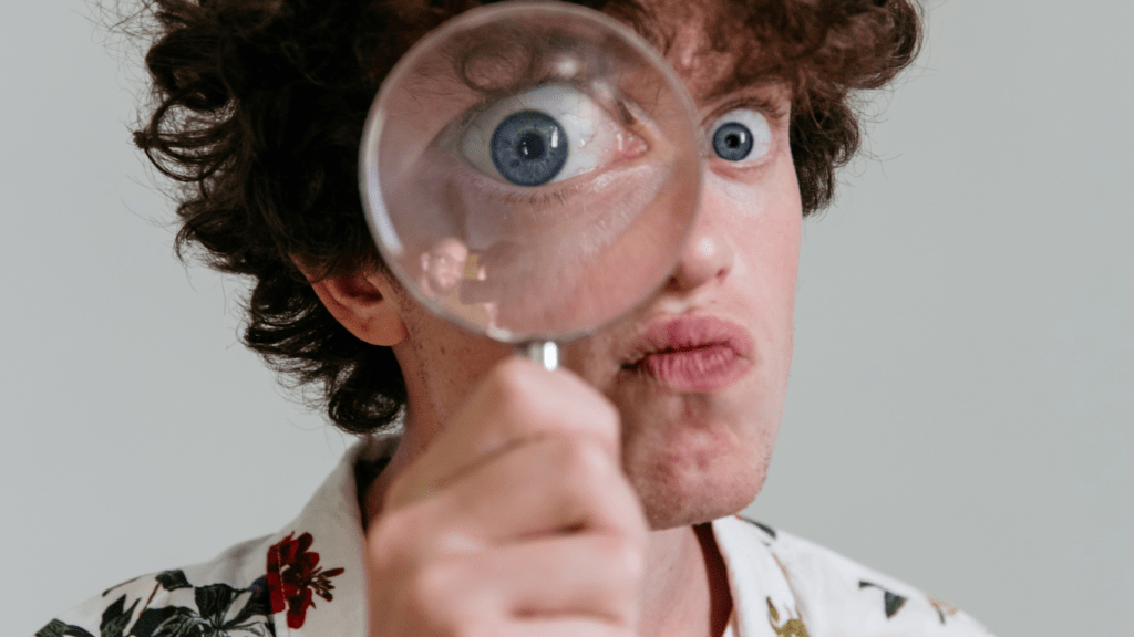 a person holding a magnifying glass