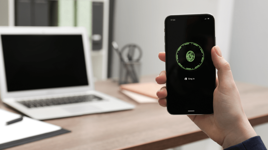 a person holding an iphone with a green circle on the screen