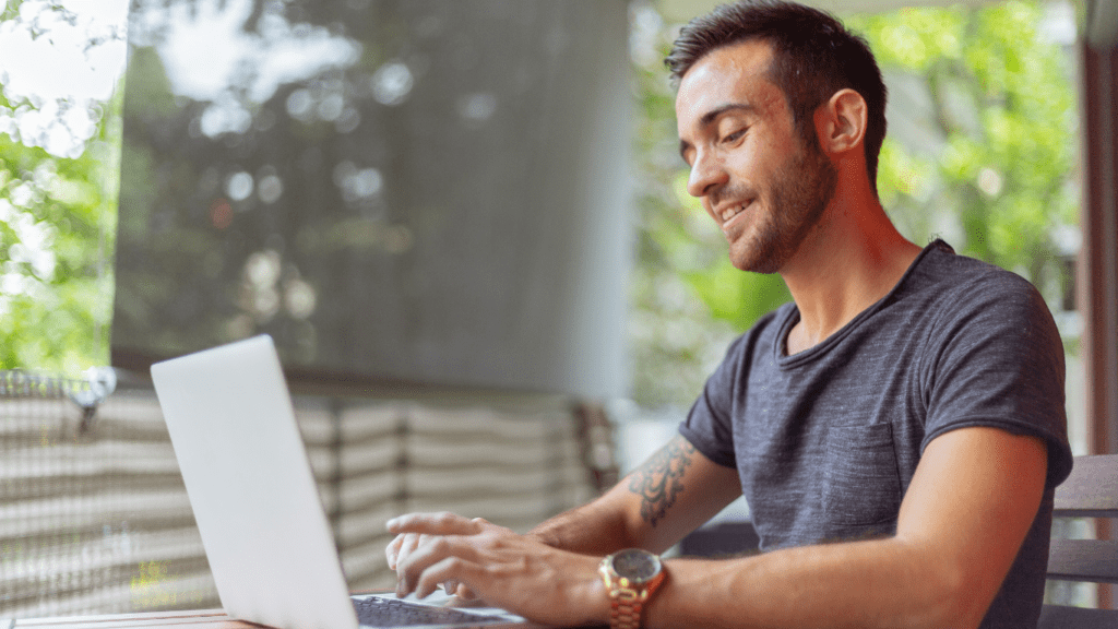 a person playing on a laptop