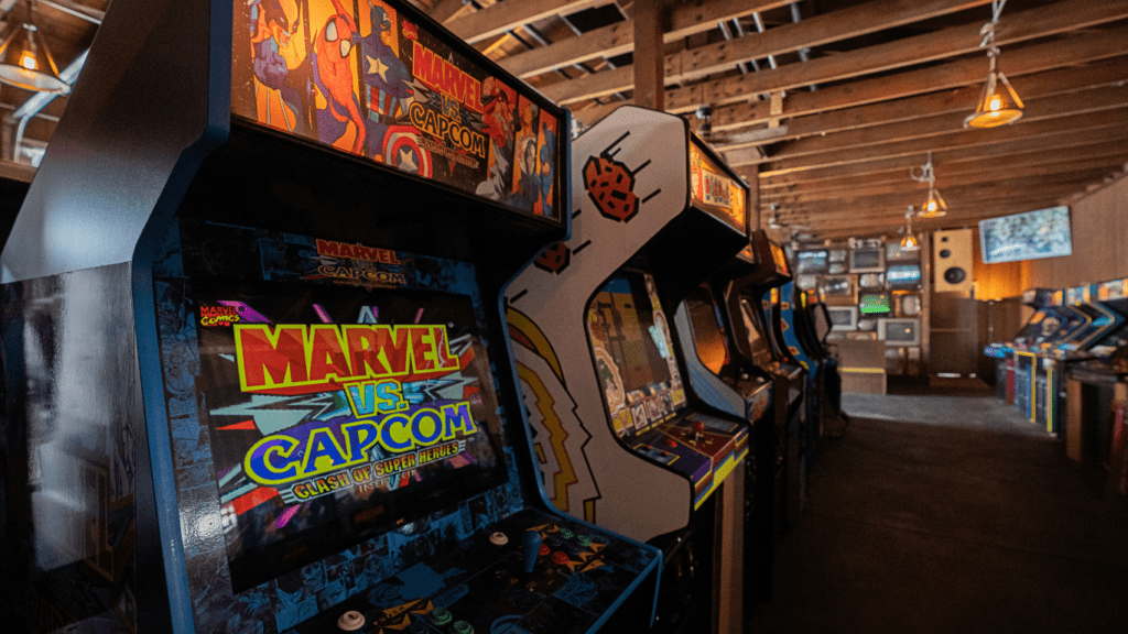 a row of arcade machines in a game room