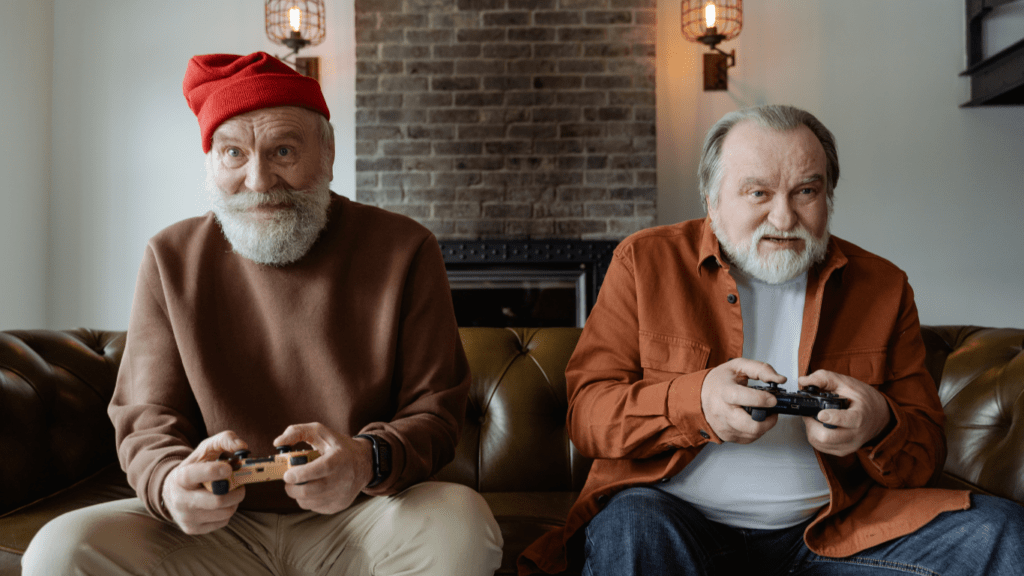 two people playing video games on a couch